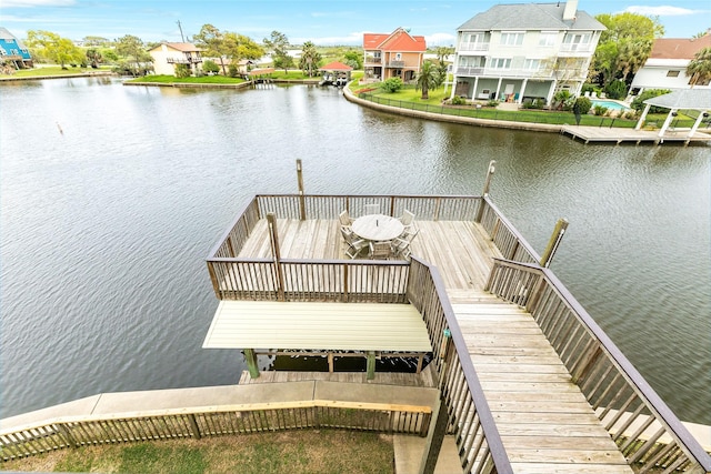 dock area with a water view and a residential view