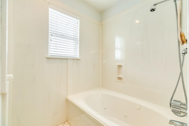 full bath featuring a shower and a jetted tub