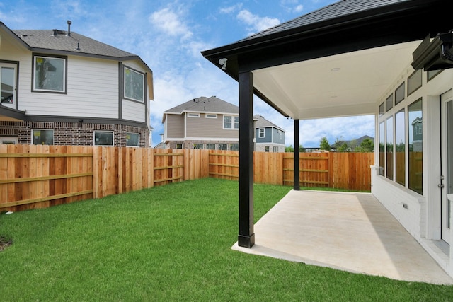 view of yard with a patio and a fenced backyard