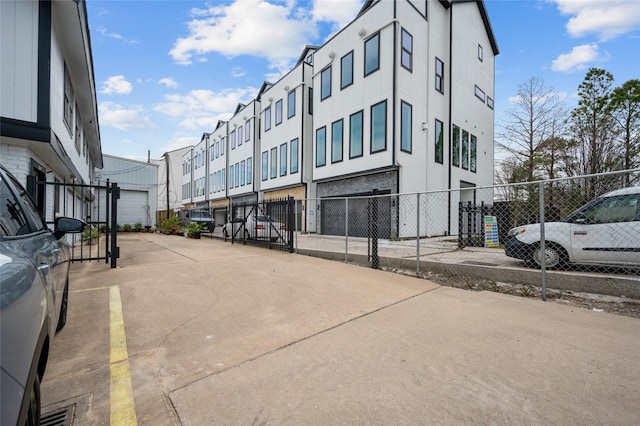 view of building exterior with fence