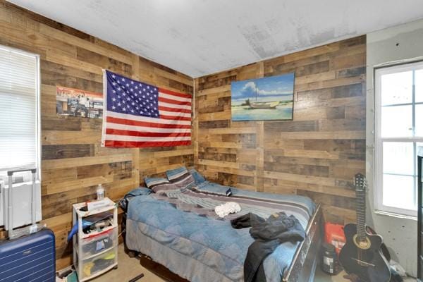 bedroom with wooden walls