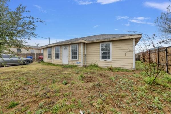 view of front of house with a fenced backyard