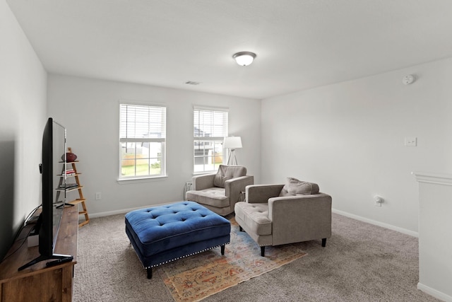 sitting room featuring carpet, visible vents, and baseboards