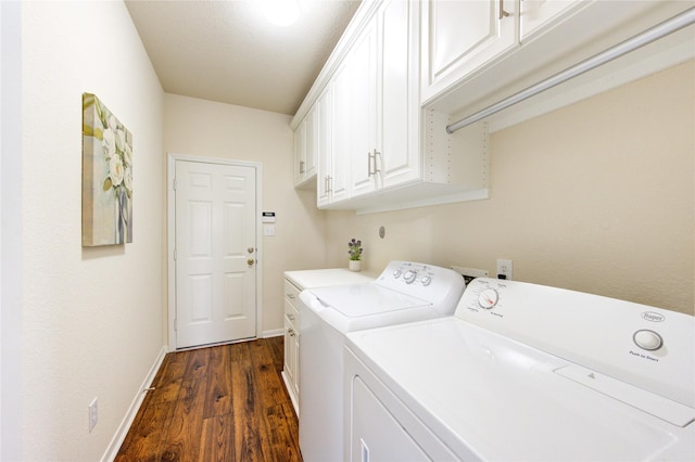 laundry area featuring dark wood-type flooring, cabinet space, independent washer and dryer, and baseboards