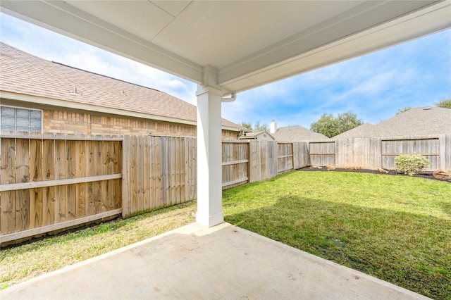 view of yard with a patio area and a fenced backyard