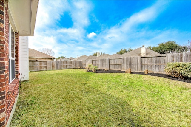 view of yard featuring a fenced backyard