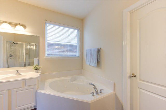 full bath with a shower stall, a tub with jets, and vanity