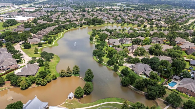 aerial view featuring a residential view and a water view