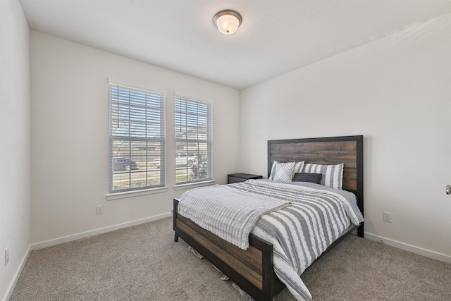 bedroom featuring carpet flooring and baseboards