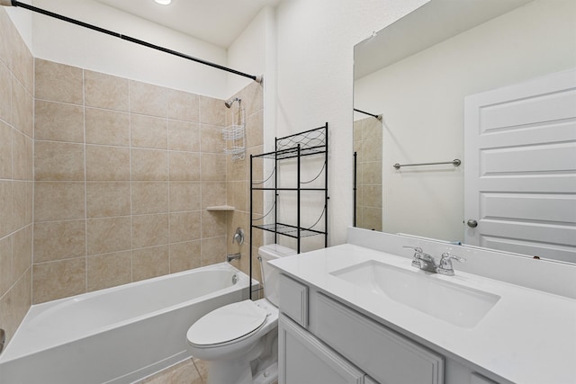 bathroom featuring vanity, bathtub / shower combination, and toilet