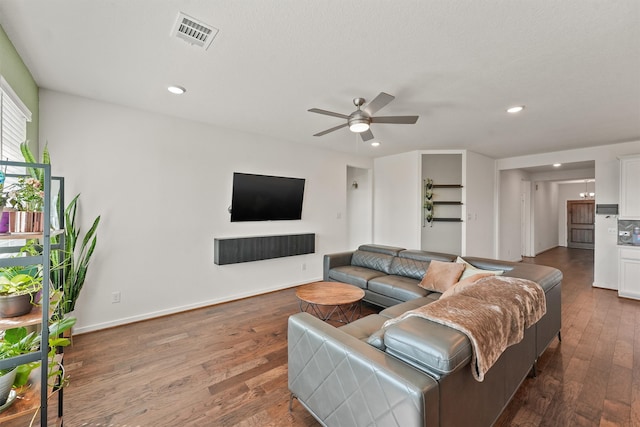 living area with baseboards, visible vents, ceiling fan, wood finished floors, and recessed lighting