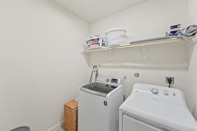 laundry room featuring laundry area and washer and clothes dryer