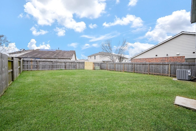 view of yard featuring cooling unit and a fenced backyard