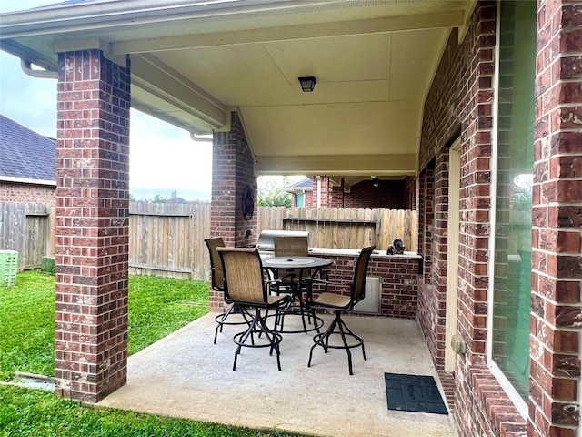 view of patio featuring fence and outdoor dining space