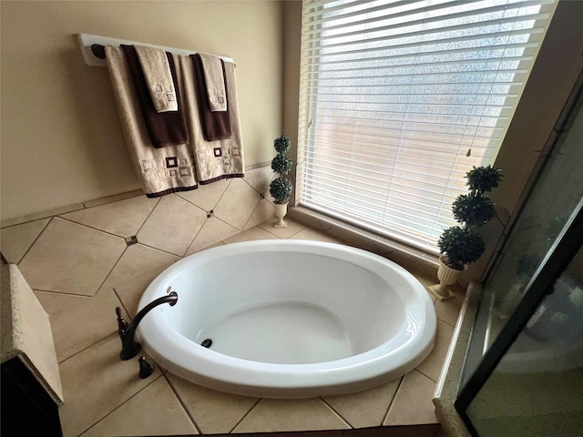 bathroom featuring a tub to relax in