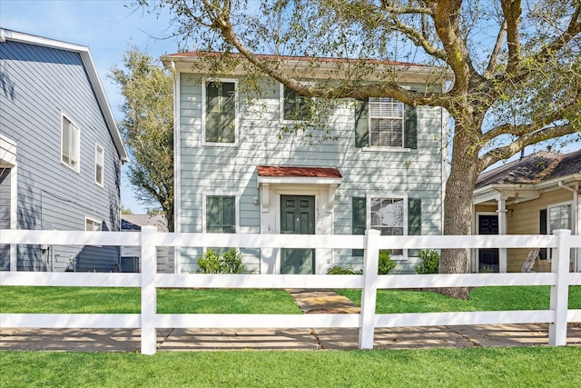 colonial house with a fenced front yard