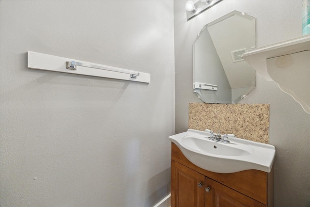 bathroom featuring visible vents and vanity