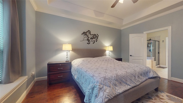 bedroom featuring baseboards, a raised ceiling, a ceiling fan, hardwood / wood-style flooring, and ornamental molding