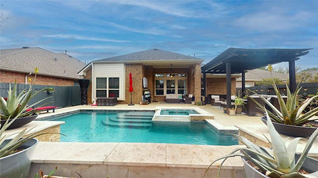 view of pool featuring a fenced backyard, a pool with connected hot tub, outdoor lounge area, and a patio