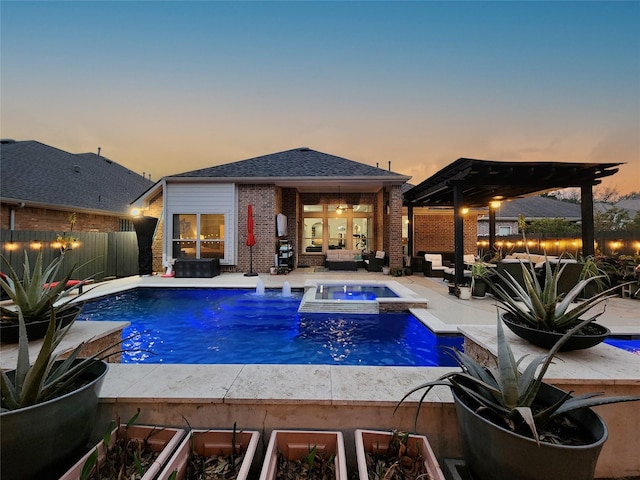 pool at dusk with an outdoor hangout area, a storage structure, an outdoor structure, and a fenced backyard