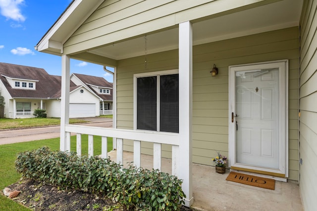 property entrance featuring a porch