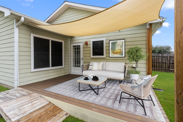 wooden terrace featuring a yard, fence, and an outdoor hangout area