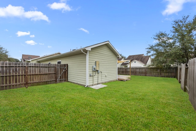 view of yard with a fenced backyard