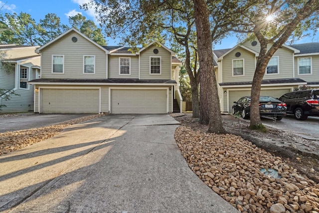 view of front of home featuring an attached garage and concrete driveway