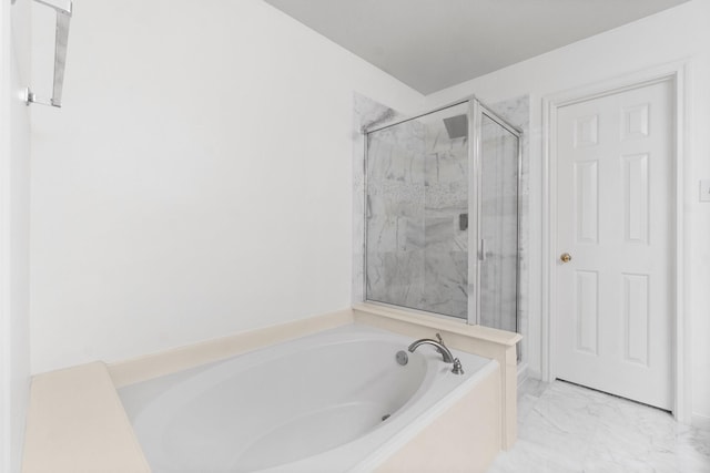 full bath with a stall shower, marble finish floor, and a bath