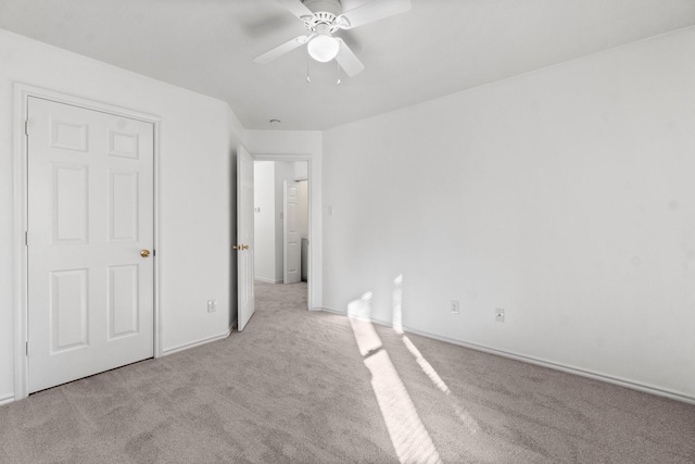 unfurnished bedroom with light carpet and ceiling fan