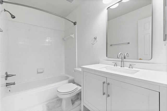 bathroom featuring toilet, marble finish floor, shower / washtub combination, and vanity