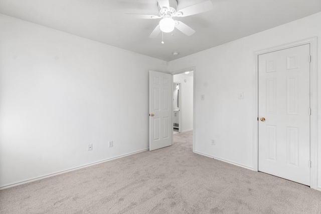 unfurnished bedroom with ceiling fan, baseboards, and carpet flooring