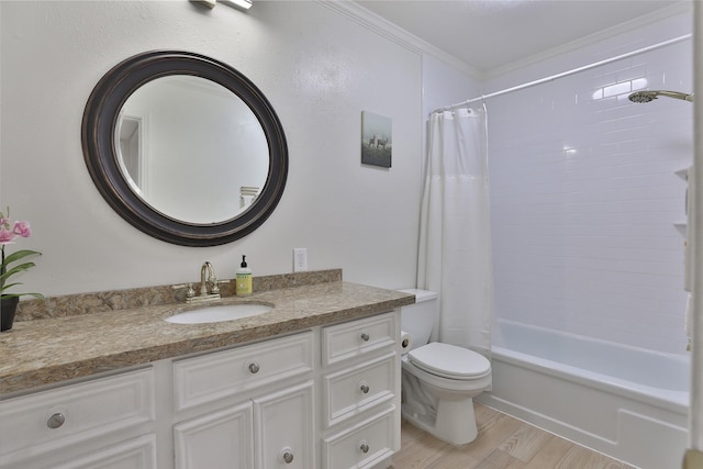 bathroom with toilet, wood finished floors, vanity, ornamental molding, and shower / bathtub combination with curtain