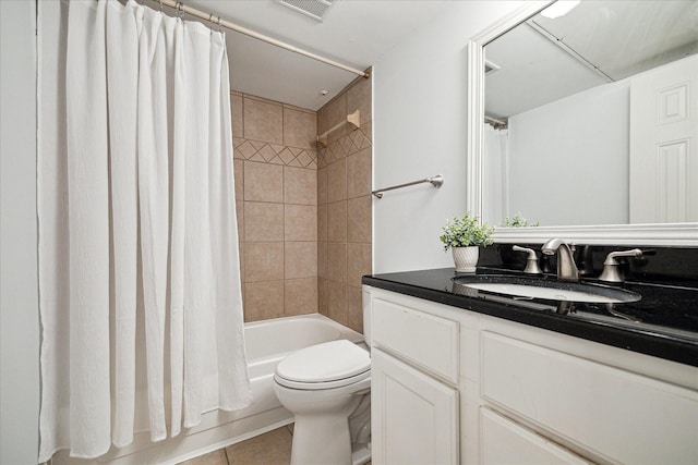 full bathroom with visible vents, toilet, shower / bath combo, vanity, and tile patterned floors