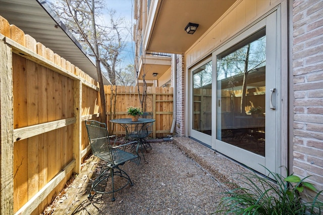 view of patio featuring fence