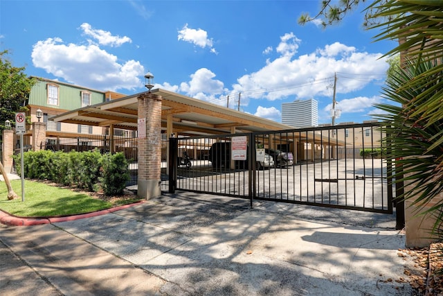 view of gate with fence