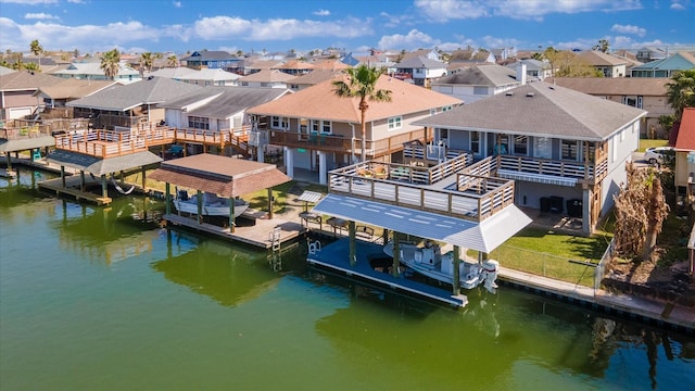 bird's eye view featuring a residential view and a water view