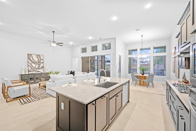 kitchen with recessed lighting, visible vents, appliances with stainless steel finishes, a kitchen island with sink, and a sink