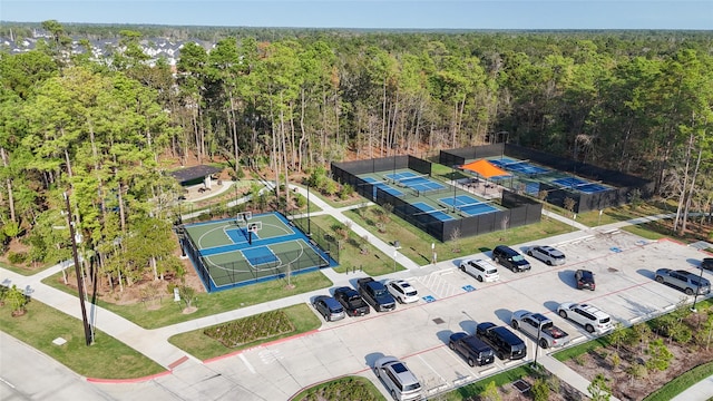 drone / aerial view with a wooded view