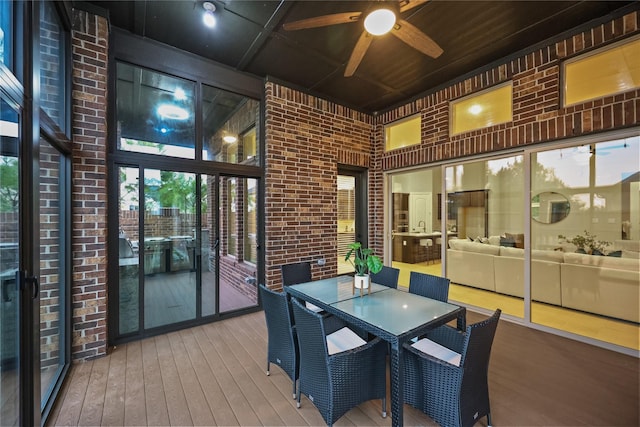 sunroom / solarium with ceiling fan