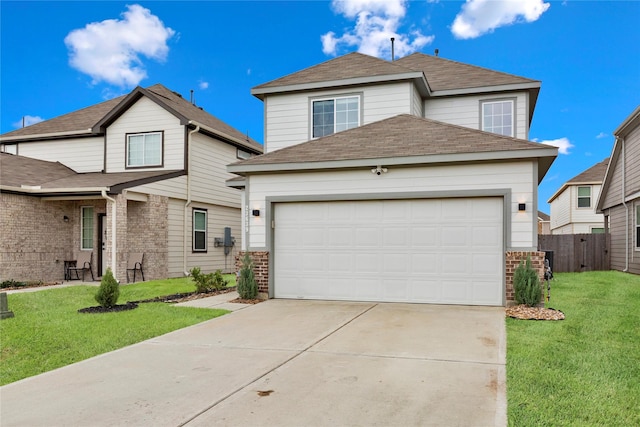 traditional home with concrete driveway, brick siding, a front lawn, and an attached garage