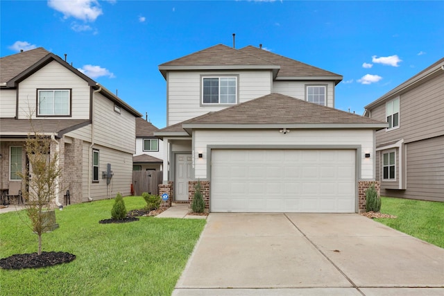 traditional home with brick siding, roof with shingles, concrete driveway, an attached garage, and a front lawn