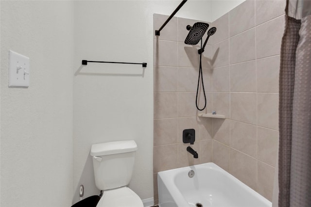 bathroom with shower / bath combo and toilet