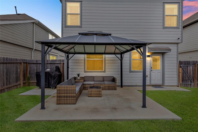 view of patio featuring a fenced backyard, a grill, outdoor lounge area, and a gazebo