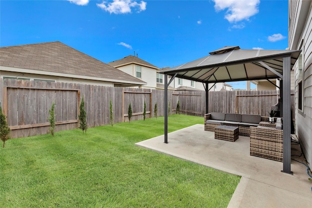 view of yard featuring a fenced backyard, a patio, an outdoor living space, and a gazebo