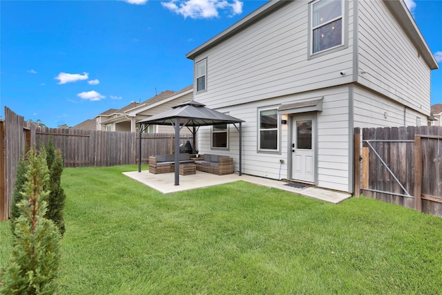 rear view of house with a fenced backyard, outdoor lounge area, a gazebo, a yard, and a patio area