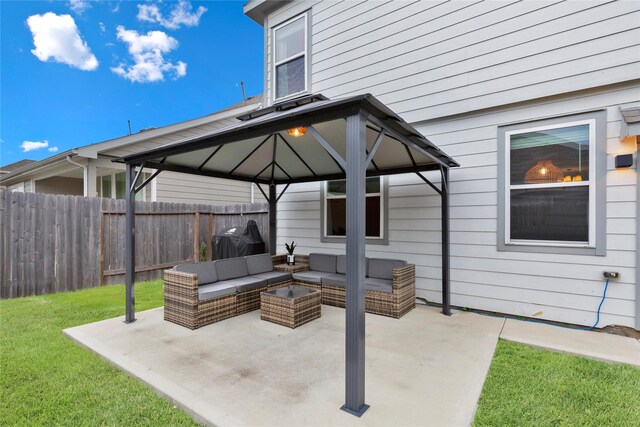 view of patio featuring fence, outdoor lounge area, area for grilling, and a gazebo