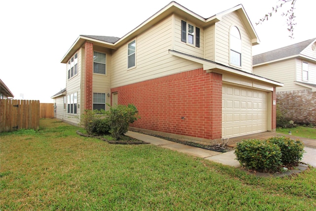 view of side of home with a garage, brick siding, fence, driveway, and a lawn