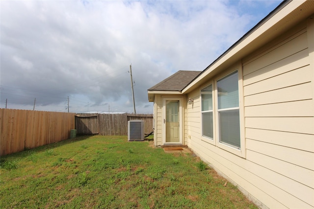 view of yard featuring a fenced backyard and cooling unit