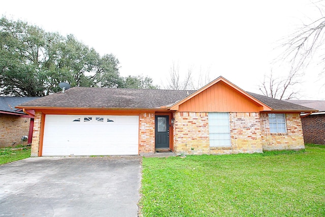 ranch-style home with driveway, brick siding, an attached garage, and a front yard